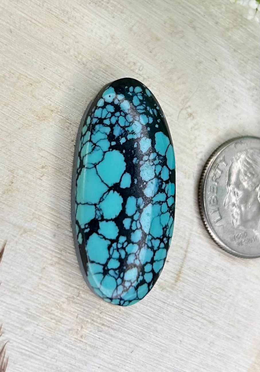 Kingman webbed turquoise cabochon